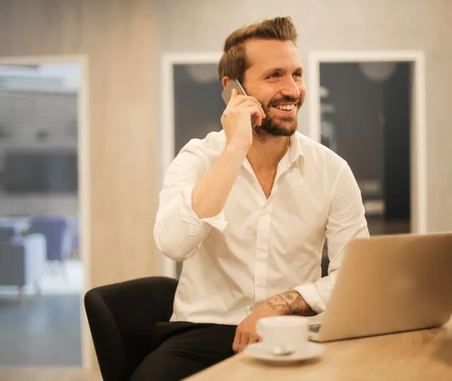 Smiling doctor reviewing a real-time finance dashboard
