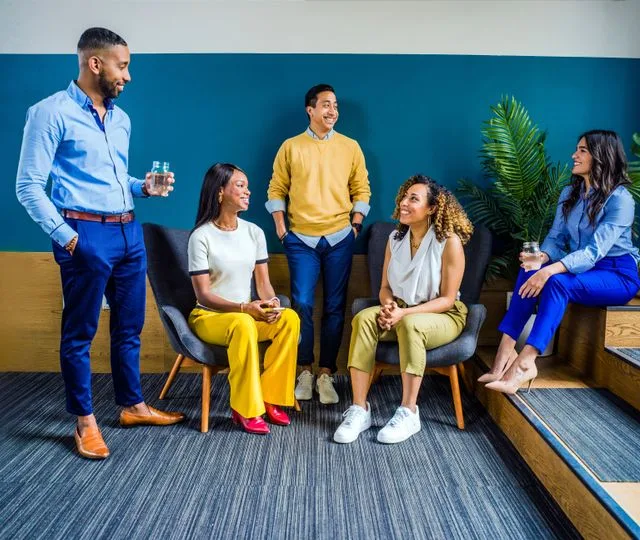 Smiling female doctor chatting with her Lucid support team
